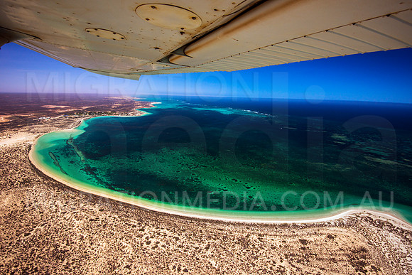 Aerial Coral Bay with Plane Wing